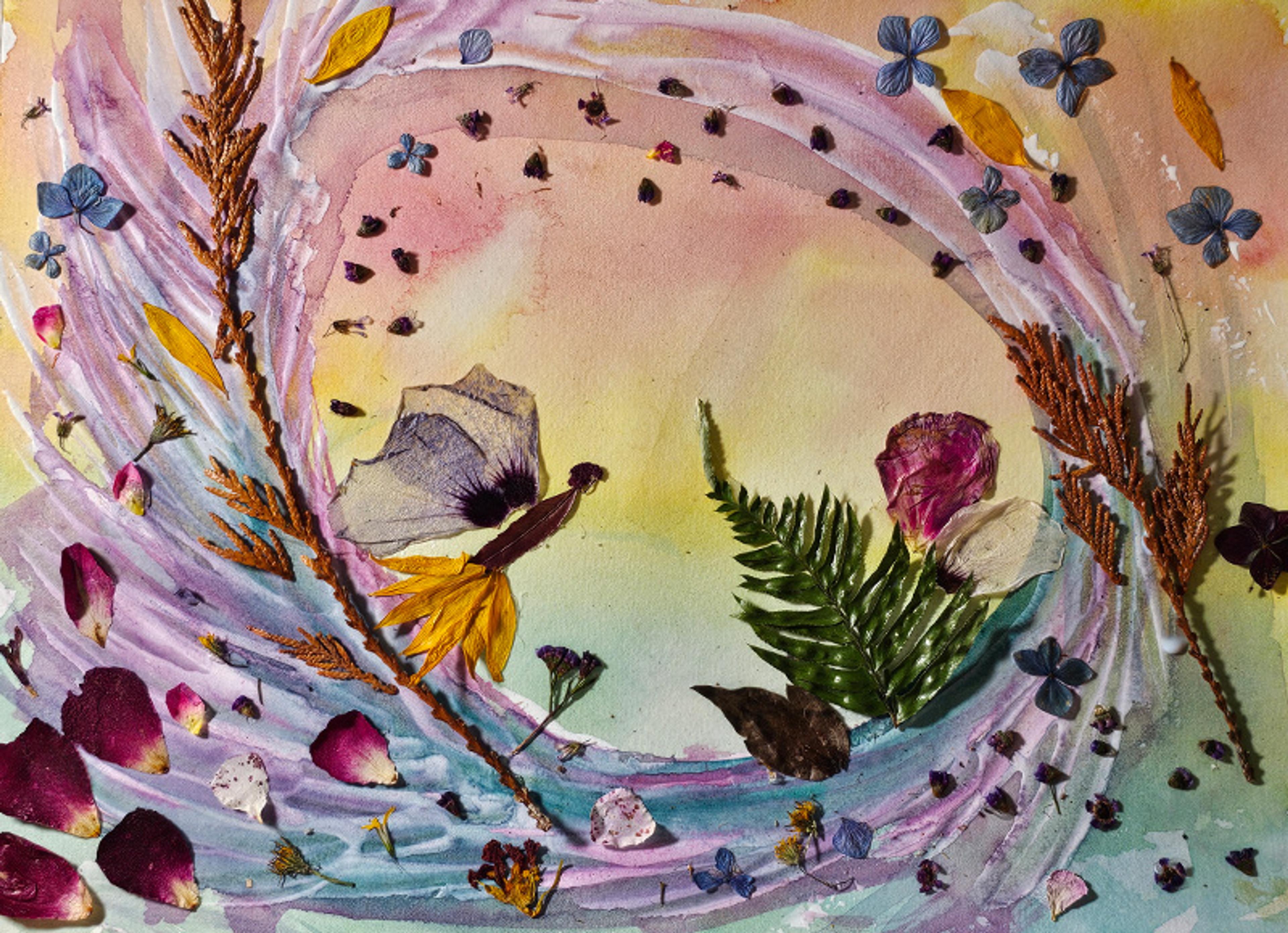 Abstract collage with pressed flowers, leaves and petals on a pastel-painted background, creating a swirling pattern.