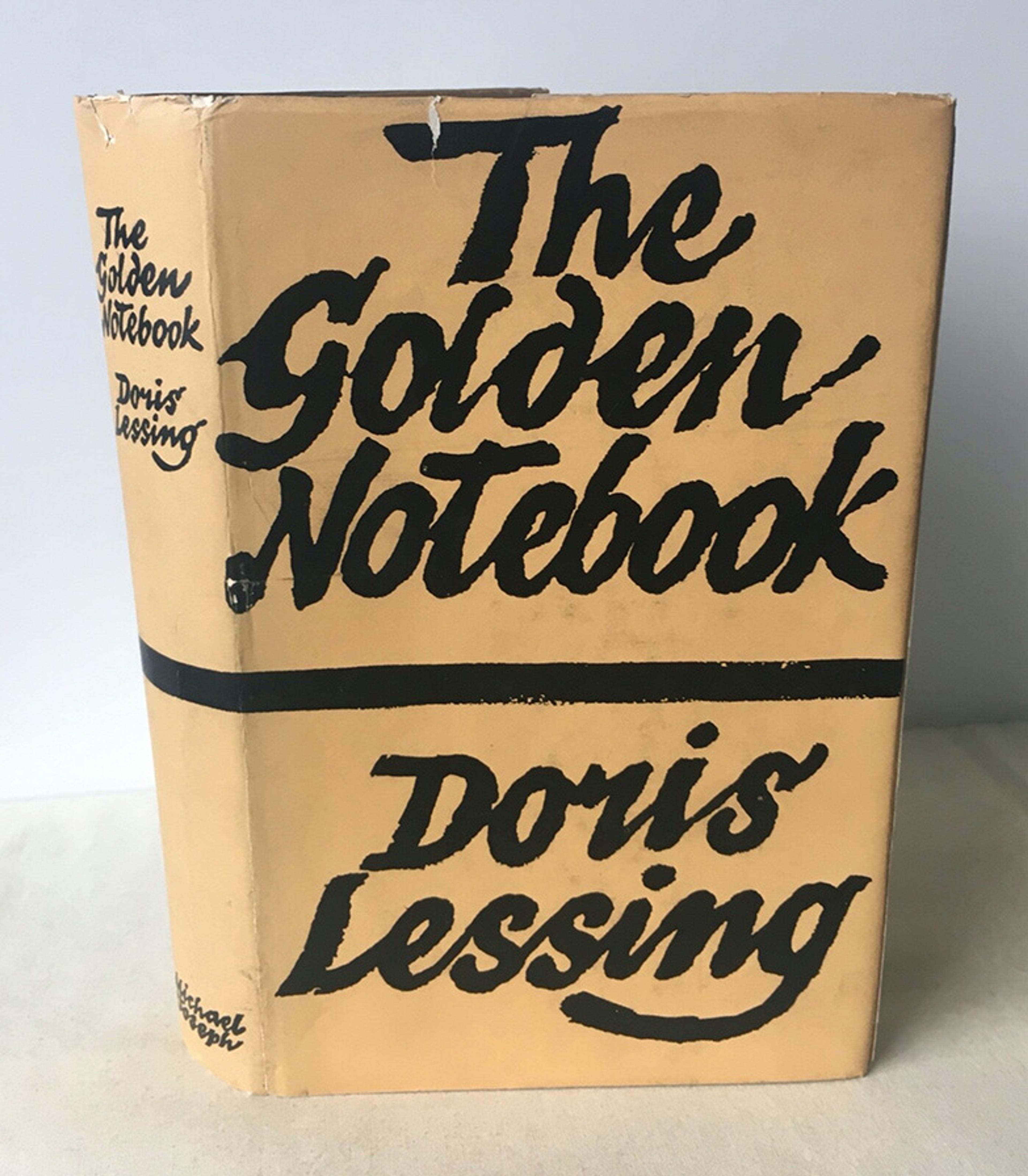 The book “The Golden Notebook” by Doris Lessing with a beige cover featuring bold black typography.
