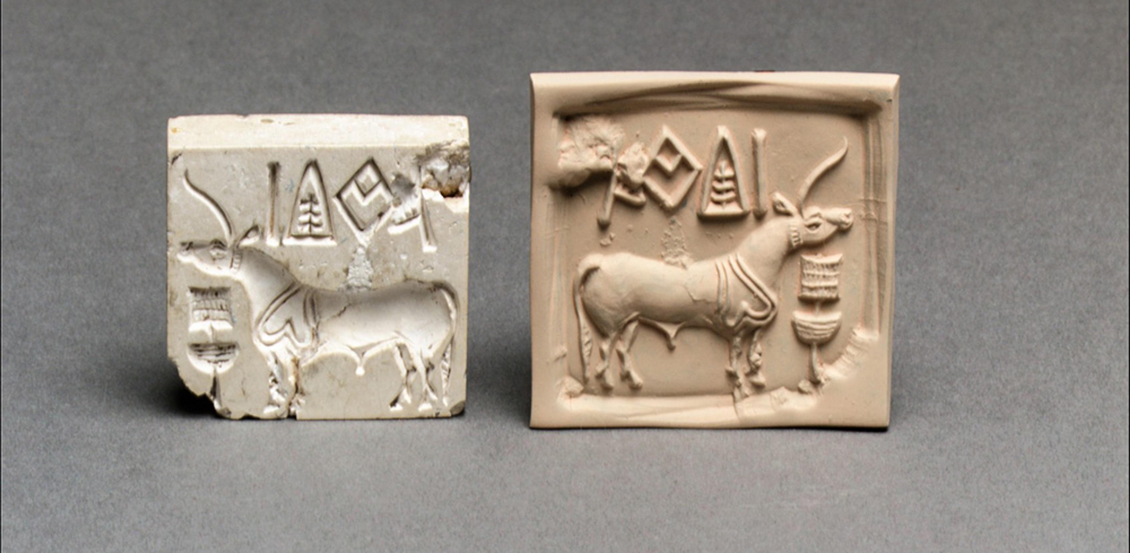 An ancient seal and its impression showing a bull with symbols above it on a grey background.
