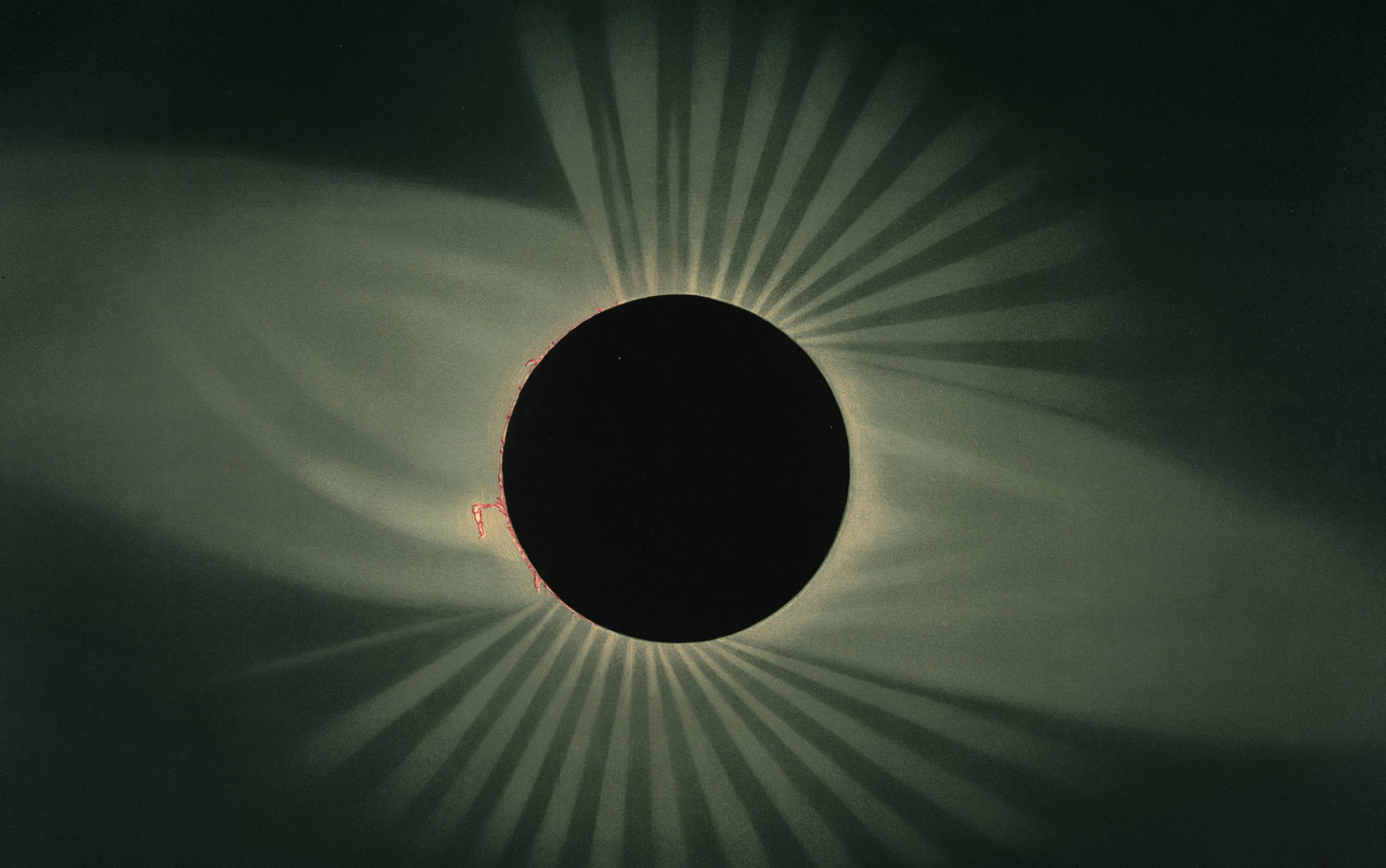 A solar eclipse showing the darkened sun surrounded by glowing light rays, creating a dramatic contrast against the dark sky.